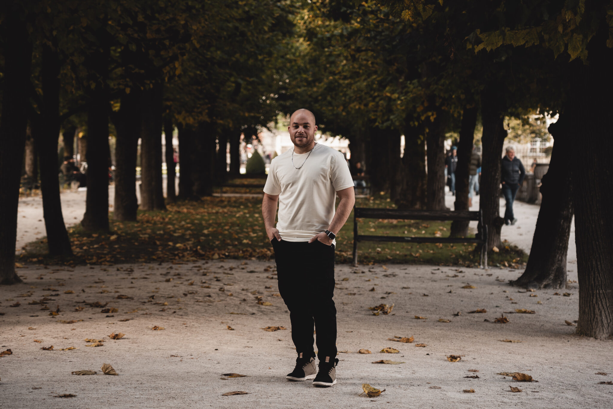 Devin standing in a park in Austria.